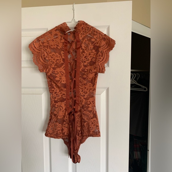 Fashion Nova lace bodysuit size Small. Ties up the entire back. Never worn. - Picture 2 of 2